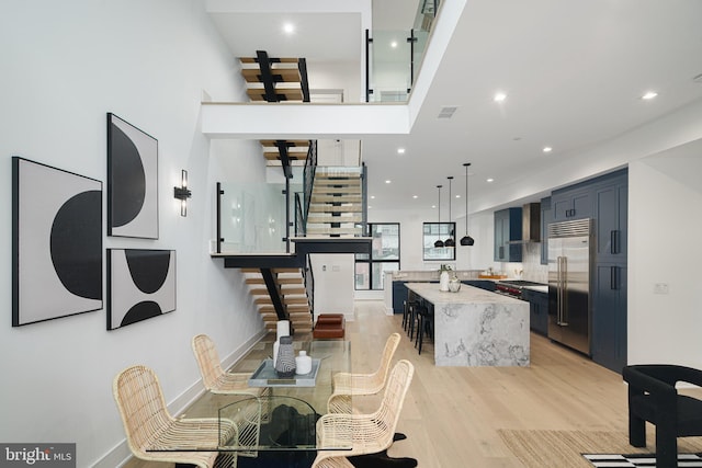 dining space featuring light wood-type flooring