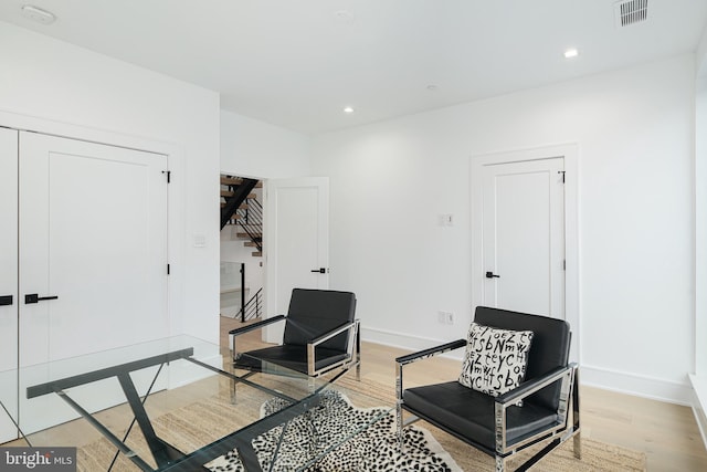 living area with wood-type flooring