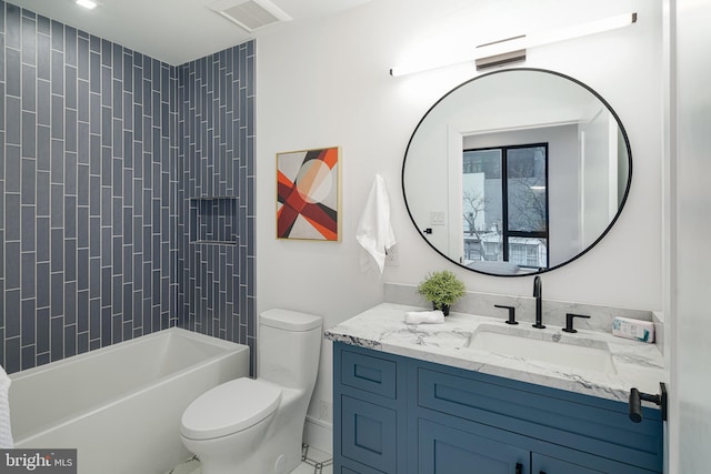 full bathroom with toilet, tiled shower / bath combo, and vanity