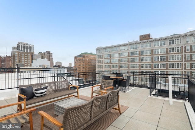 view of patio / terrace with a balcony and an outdoor hangout area