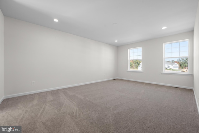 spare room featuring carpet floors