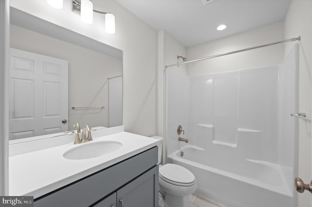 full bathroom featuring vanity, shower / bath combination, tile patterned floors, and toilet