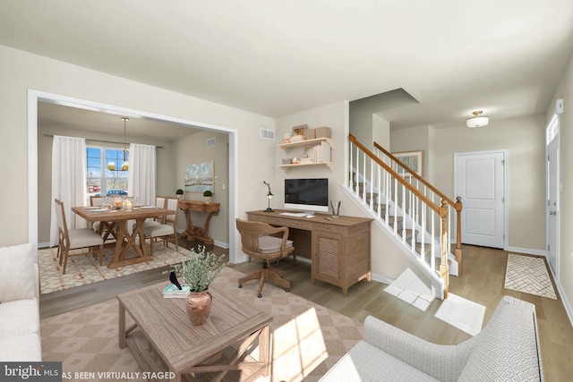 living room with light hardwood / wood-style floors