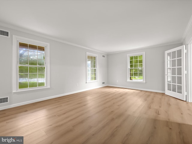 8018 Martown Rd, Laurel, MD 20723 - spare room featuring ornamental molding, healthy amount of natural light, and light wood-type flooring