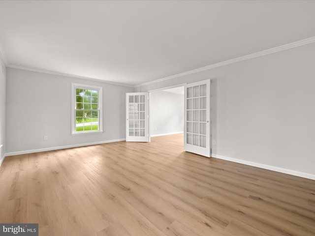 8018 Martown Rd, Laurel, MD 20723 - spare room with ornamental molding, french doors, and light wood finished floors