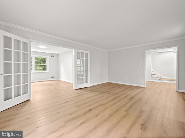8018 Martown Rd, Laurel, MD 20723 - empty room featuring light wood-type flooring, ornamental molding, stairway, and french doors