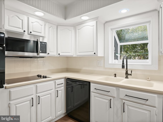 8018 Martown Rd, Laurel, MD 20723 - kitchen featuring black appliances, white cabinetry, tasteful backsplash, light countertops, and recessed lighting