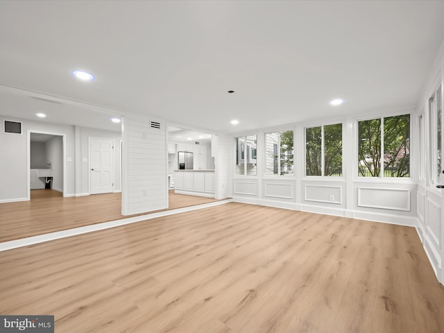 8018 Martown Rd, Laurel, MD 20723 - unfurnished living room featuring light wood-style flooring and recessed lighting