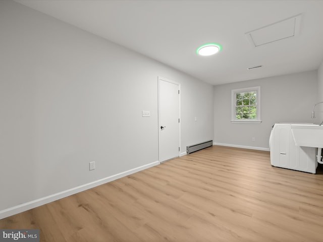 8018 Martown Rd, Laurel, MD 20723 - laundry area with baseboard heating, light wood-style floors, washer / dryer, and attic access
