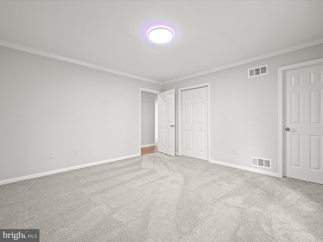 8018 Martown Rd, Laurel, MD 20723 - unfurnished bedroom with crown molding, carpet floors, and a closet