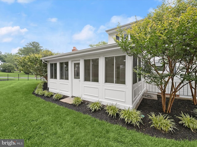 8018 Martown Rd, Laurel, MD 20723 - view of home's exterior with a sunroom and a chimney