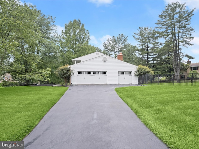 8018 Martown Rd, Laurel, MD 20723 - view of front of home featuring an outdoor structure, a garage, and a chimney