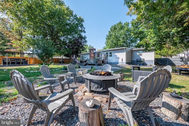 view of patio with a fire pit