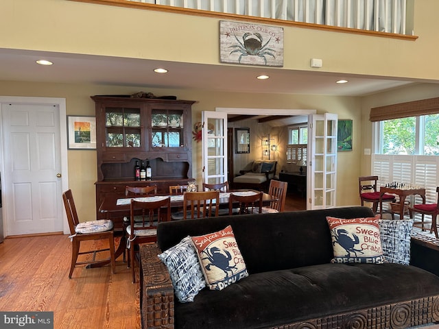 living room featuring light hardwood / wood-style floors and french doors