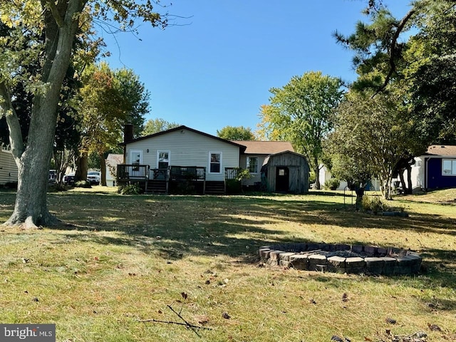 view of yard featuring a shed and a deck