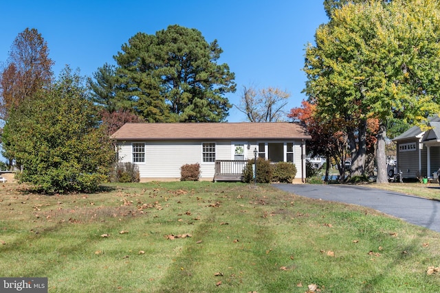 ranch-style house with a front lawn