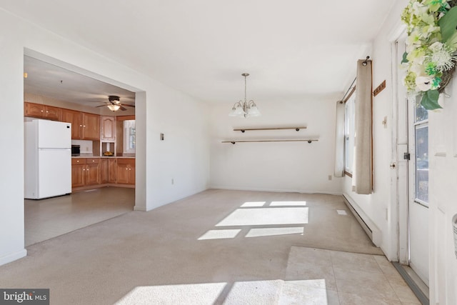 interior space featuring a baseboard heating unit and ceiling fan with notable chandelier