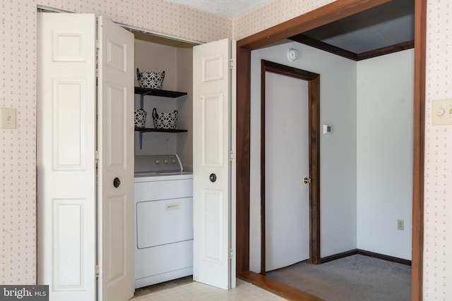 clothes washing area with washer / clothes dryer