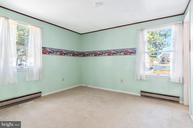 carpeted empty room with plenty of natural light and a baseboard radiator