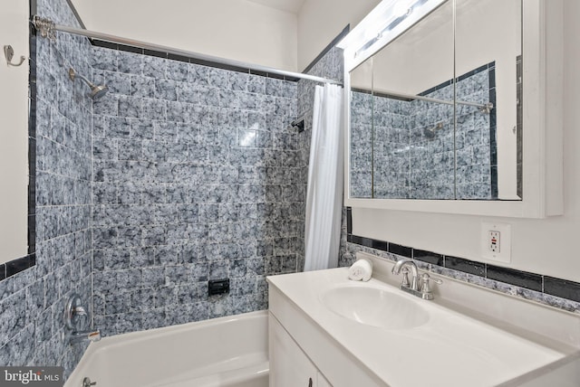 bathroom featuring vanity and shower / tub combo