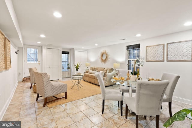 dining area with light tile patterned floors