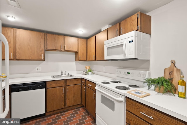 kitchen with sink and white appliances