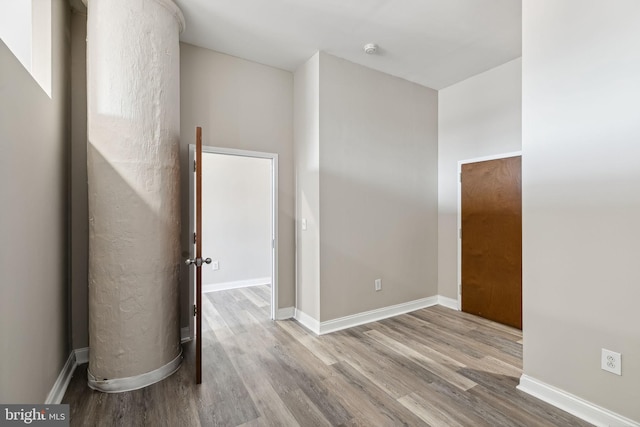 unfurnished room with light hardwood / wood-style floors