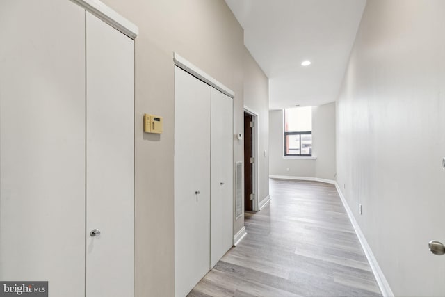 corridor featuring light hardwood / wood-style floors