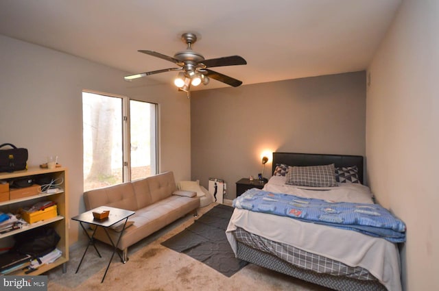 bedroom with ceiling fan and carpet floors