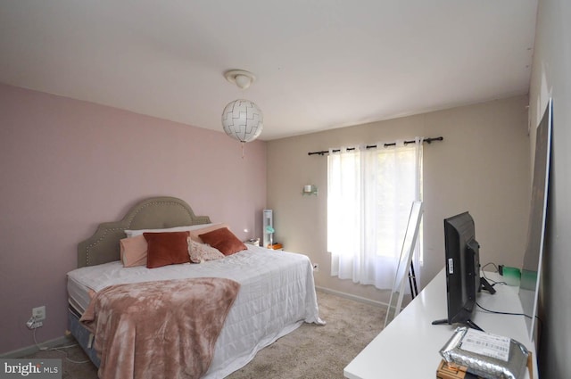 bedroom featuring light colored carpet