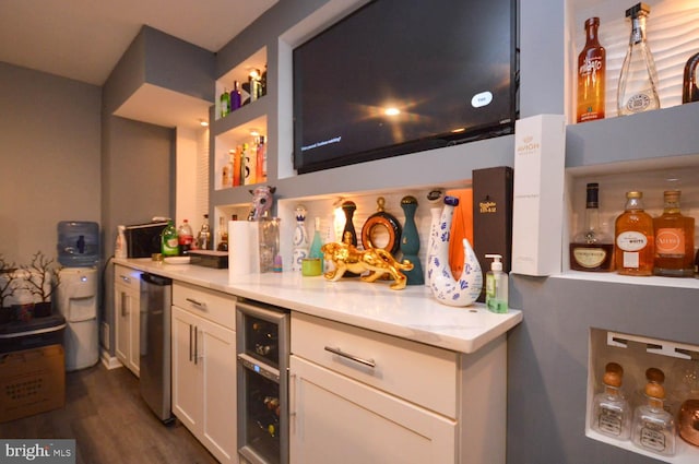 kitchen with dark hardwood / wood-style flooring, beverage cooler, white cabinets, dishwasher, and light stone countertops