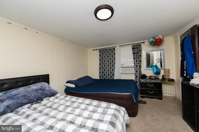 carpeted bedroom with crown molding