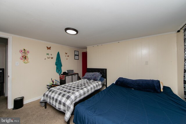 carpeted bedroom featuring ornamental molding