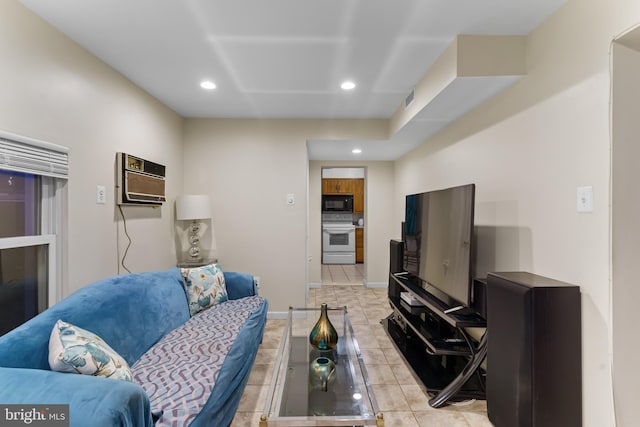 tiled living room featuring a wall mounted AC