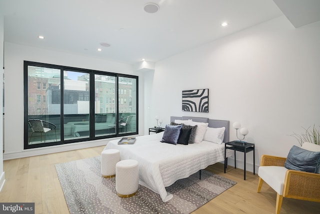 bedroom with light hardwood / wood-style flooring