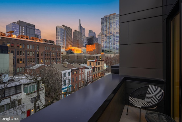 view of balcony at dusk