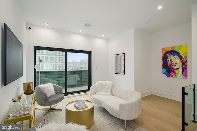 sitting room with light hardwood / wood-style flooring