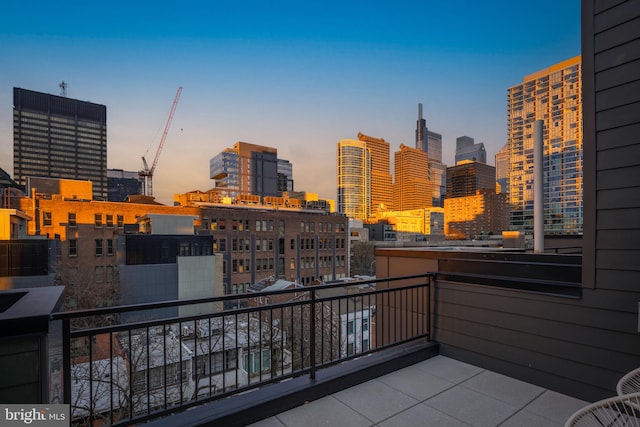 view of balcony at dusk