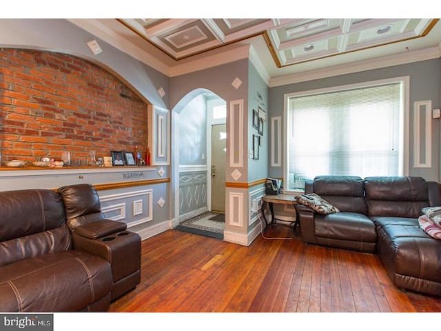 living room with ornamental molding, beam ceiling, coffered ceiling, and wood-type flooring