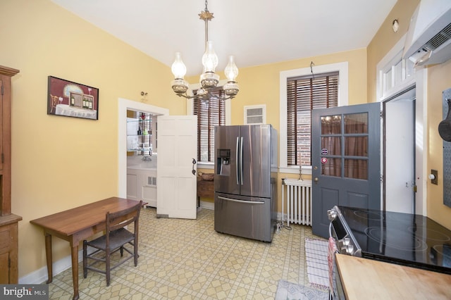 kitchen with black stove, pendant lighting, white cabinets, a chandelier, and stainless steel refrigerator with ice dispenser