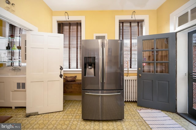 kitchen with stainless steel fridge with ice dispenser