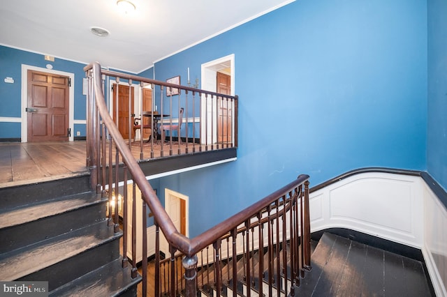 stairway featuring wood-type flooring