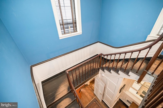 stairway featuring hardwood / wood-style floors