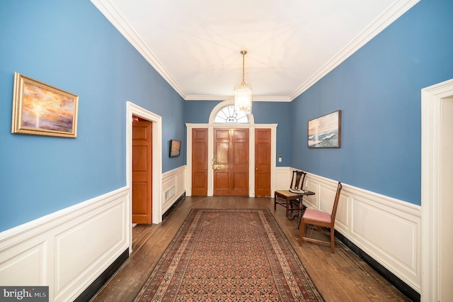 foyer featuring crown molding and dark wood-type flooring