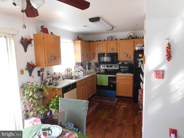 kitchen with sink, black appliances, dark hardwood / wood-style floors, and ceiling fan