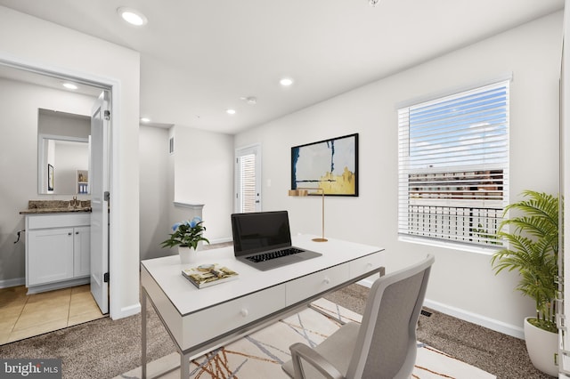 carpeted office with sink