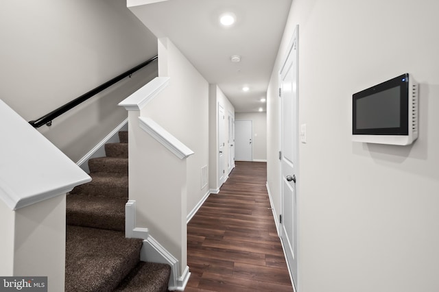 stairs with wood-type flooring