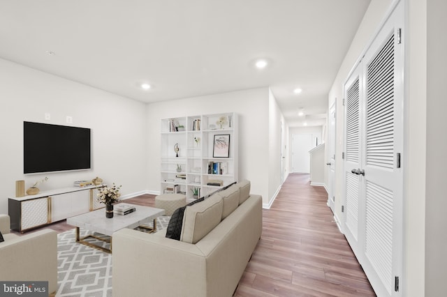 living room with light hardwood / wood-style flooring