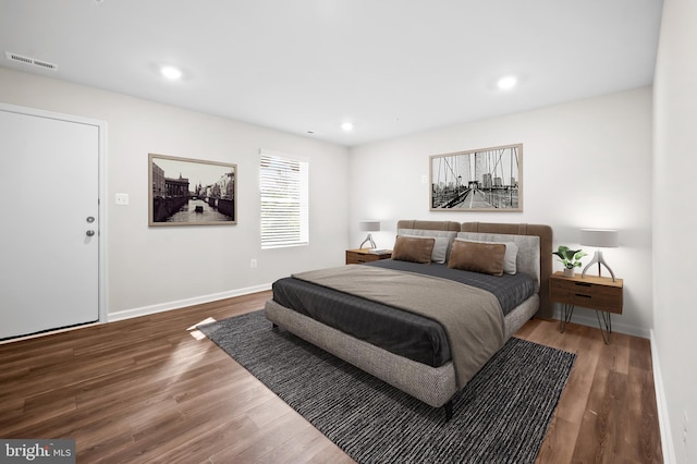 bedroom featuring dark hardwood / wood-style flooring