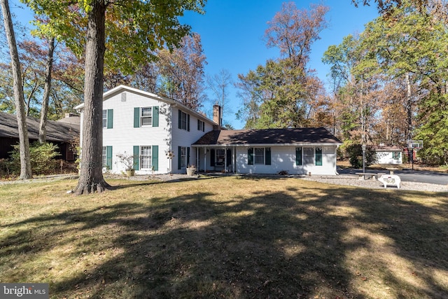 back of house featuring a yard